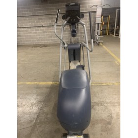In a concrete-walled gym with yellow lines marking the floor, a Precor 534 Elliptical - As Is Functional awaits your next workout.