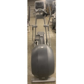 A Cybex 626 Arc Trainer - As Is Functional stands prominently in a gym, surrounded by other exercise equipment in the background.