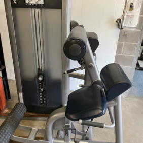 The gym's Life Fitness Signature Back Extension - As Is Functional offers a padded seat, ergonomic design, and adjustable weight settings for an enhanced workout experience.