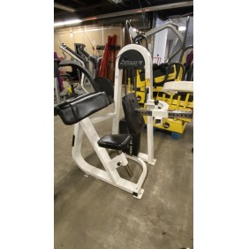 A white and black Stream Line Tricep - As Is Functional arm curl machine is positioned in a gym with various exercise equipment in the background.
