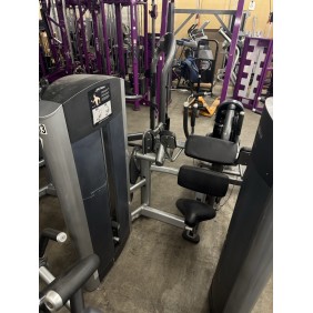 A gym equipped with the Hoist Roc-It "PL Bicep Curl - As Is Functional" and a concrete floor, perfect for leg extensions, curls, or biceps training.