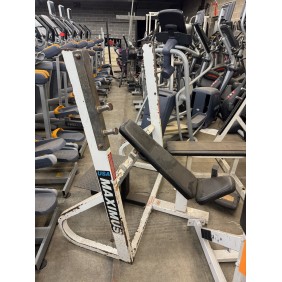 The Maximus Incline Bench Press - As Is Functional, despite its rusted frame, continues to operate among other gym equipment in storage.