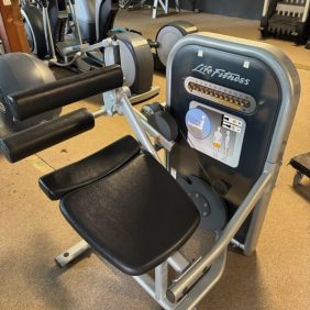 The Life Fitness Circuit Series - Serviced seated bicep curl machine features a black seat and gray frame, with clear instructions on the front panel, ensuring optimal gym experiences.