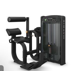 A black Matrix leg extension machine with padded seat, backrest, and leg supports, weight stack, and adjustment knobs, designed for strength training exercises.